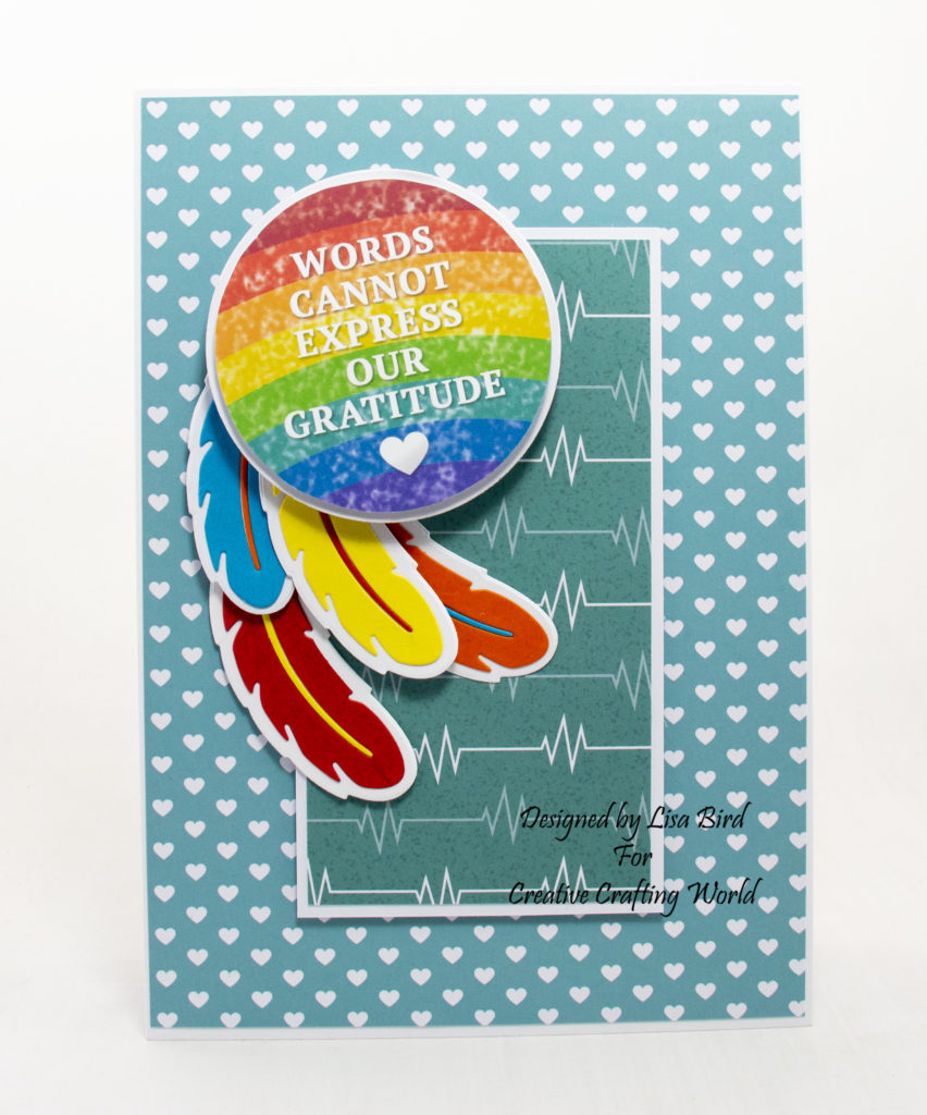 handmade card has been created using a paper collection called Hope and Sunshine from Creative Crafting World.