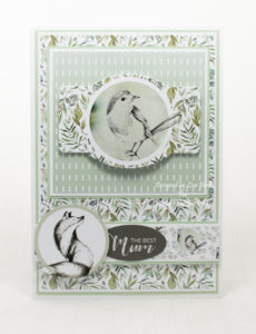 handmade card has been created using a paper collection called Enchanted Forest